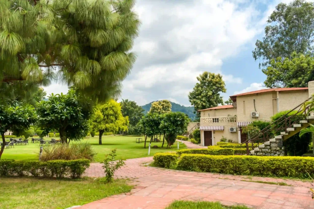 Best resorts in Jim Corbett near Dhikala Gate featuring lush gardens, spacious cottages, and a peaceful natural setting for wildlife travelers.