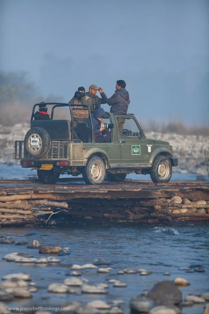 Jim Corbett safari permit for jeep safari crossing a river during a wildlife tour