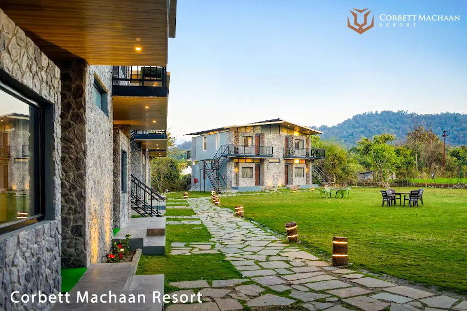 Resort stay included in Jim Corbett Packages near the forest landscape