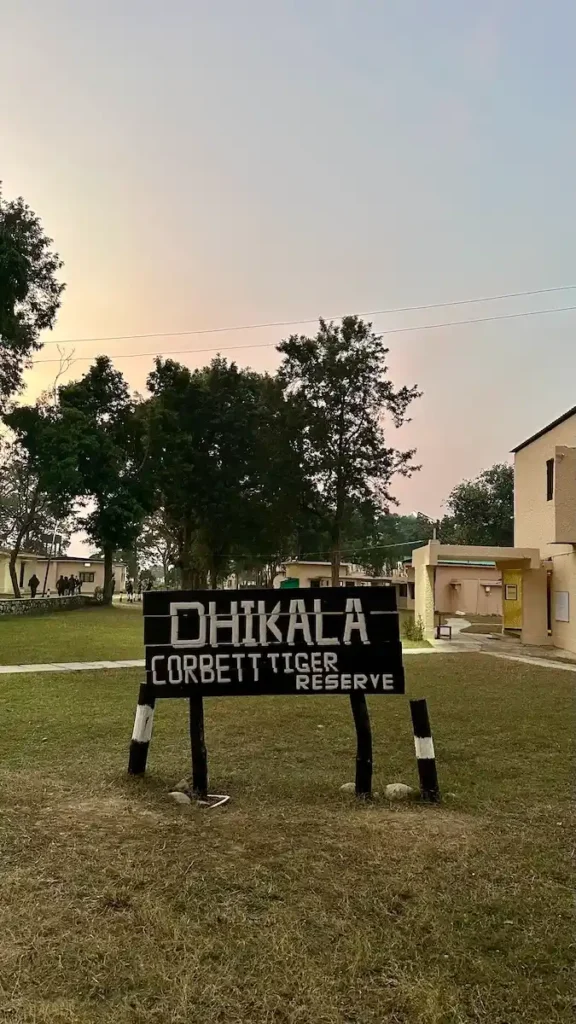 Entrance sign of Dhikala Forest Rest House in Jim Corbett Tiger Reserve, a popular stay for wildlife enthusiasts.